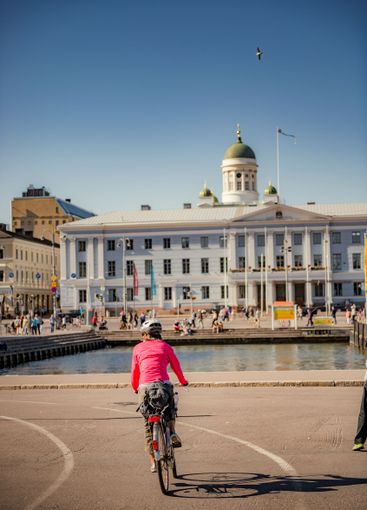 Cyclist on street in Helsinki, Finland