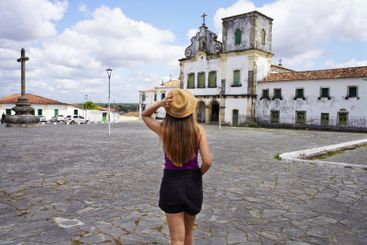 Tourism in Sao Cristovao, Brazil. Young traveler woman...