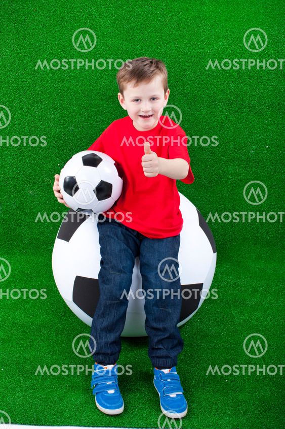 Happy young boy with soccer ball