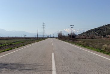 Rural road a view of the mountains and fields
