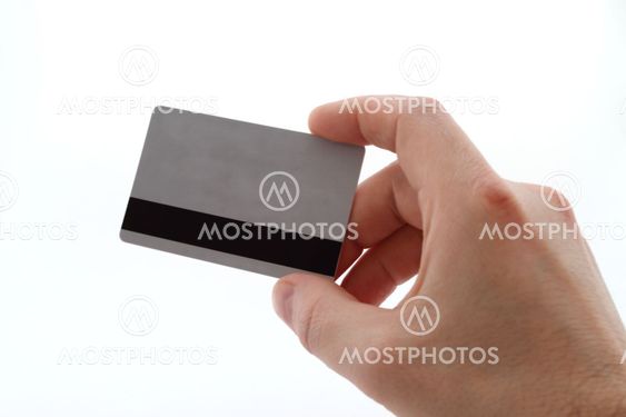 hand with bank card on white background into large pieces