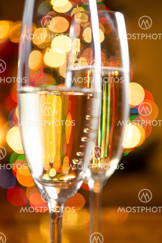 abstract photo of champagne in glasses against colorful...