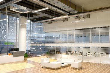 Office reception area with natural light and view of...