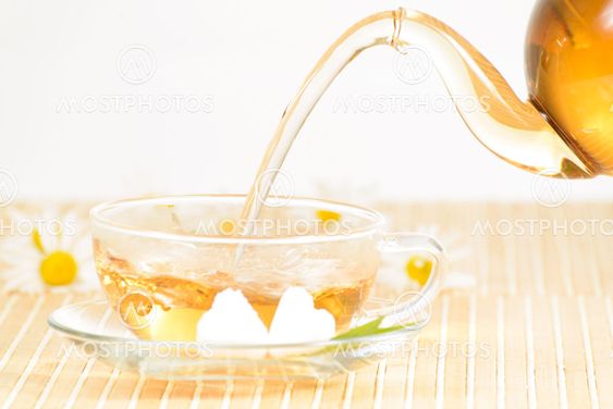 teacup with herbal chamomile tea