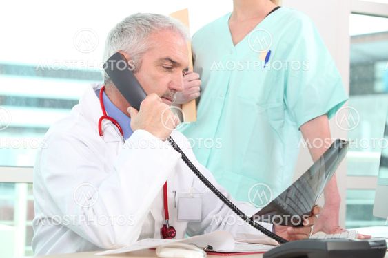 Senior doctor having a phone call