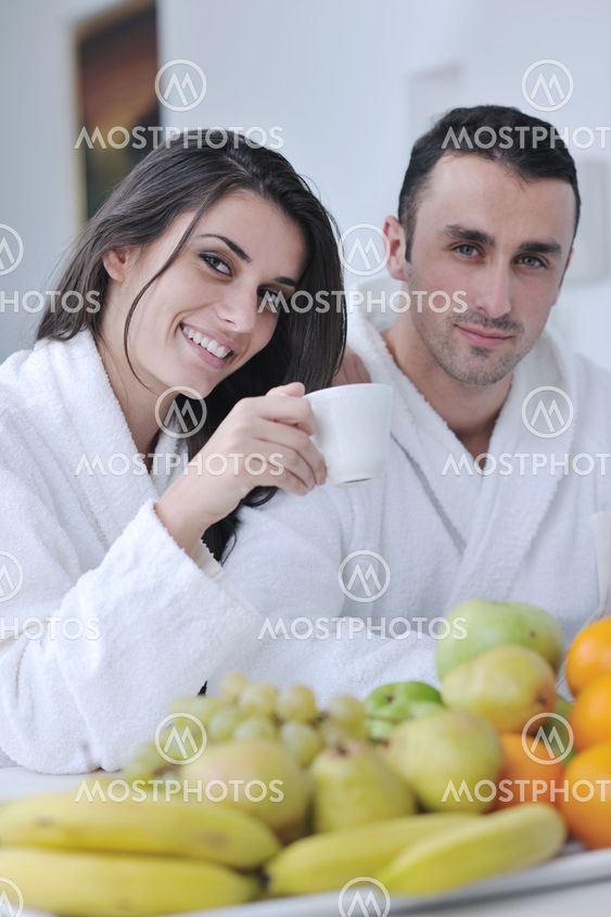 young couple have fun in modern kitchen