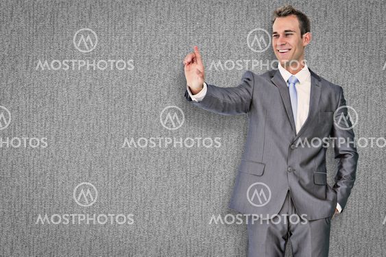 Composite image of businessman pointing