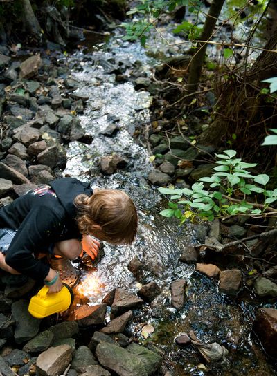 Boy searching for crawfish