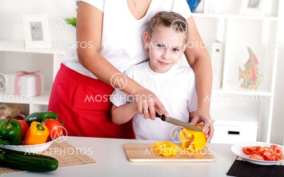 mom and daughter cooking together