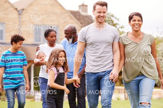 Smiling Multi-Generation Mixed Race Family In Garden At...