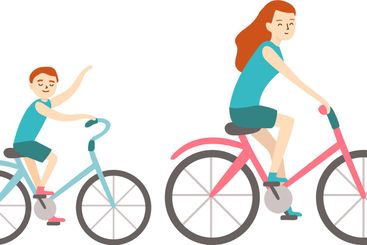 Mother and son riding bicycles, with the son waving and...