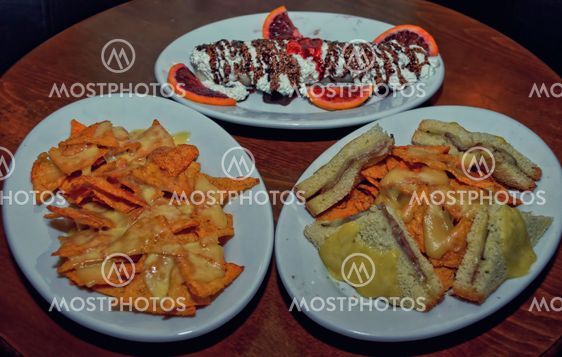 Chips with cheese, club sandwich and pancake